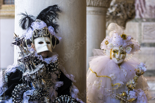 Venice carneval mask - couple beetwen columns