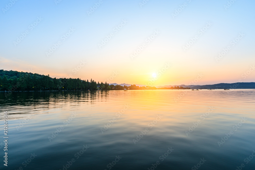 Beautiful lake and hill landscape at sunset
