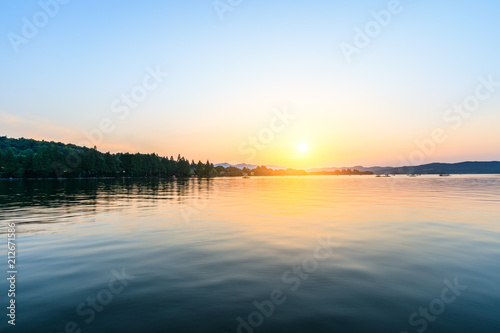 Beautiful lake and hill landscape at sunset