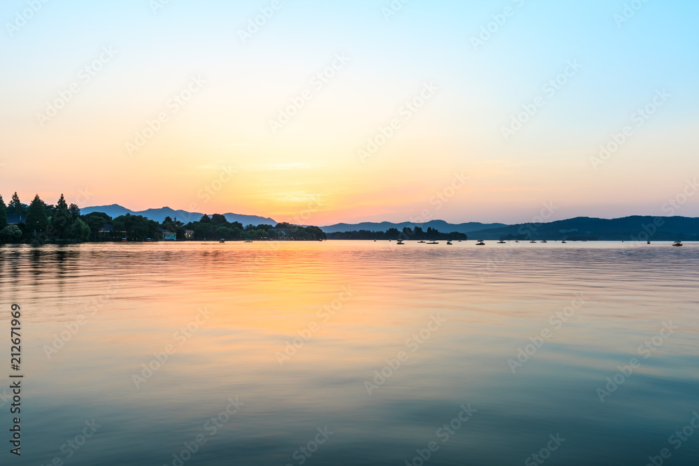 Beautiful lake and hill landscape at sunset