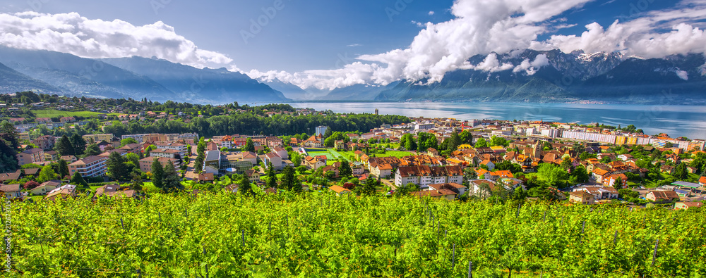 Fototapeta premium Panorama view of Montreux city with Swiss Alps, lake Geneva and vineyard on Lavaux region, Canton Vaud, Switzerland, Europe