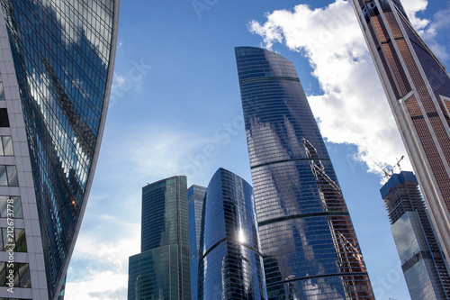 Moscow  Russia - 07 09 2018  Bottom view of Moscow-City skyscrapers with futuristic design with reflection of clouds