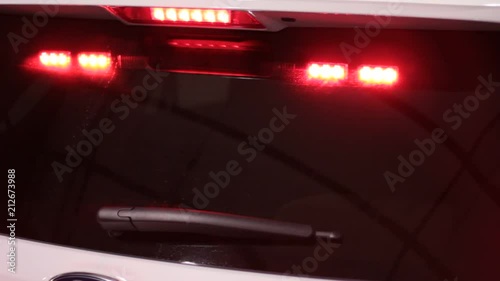 Close up of hidden police lights in the back of a unmarked police vehicle.