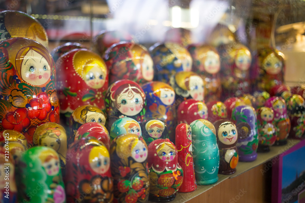 Moscow, Russia - 07 09 2018: a stall selling traditional Russian gifts, nesting dolls, spoons, glass bowls in a shop window.