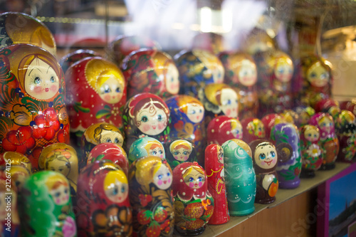 Moscow, Russia - 07 09 2018: a stall selling traditional Russian gifts, nesting dolls, spoons, glass bowls in a shop window. © Alexandra