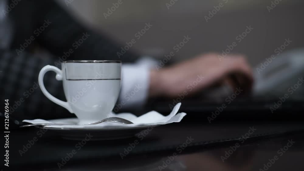 Male hands typing on a laptop Male hands typing on a laptop