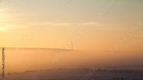 Countryside winter landscape at sunset 