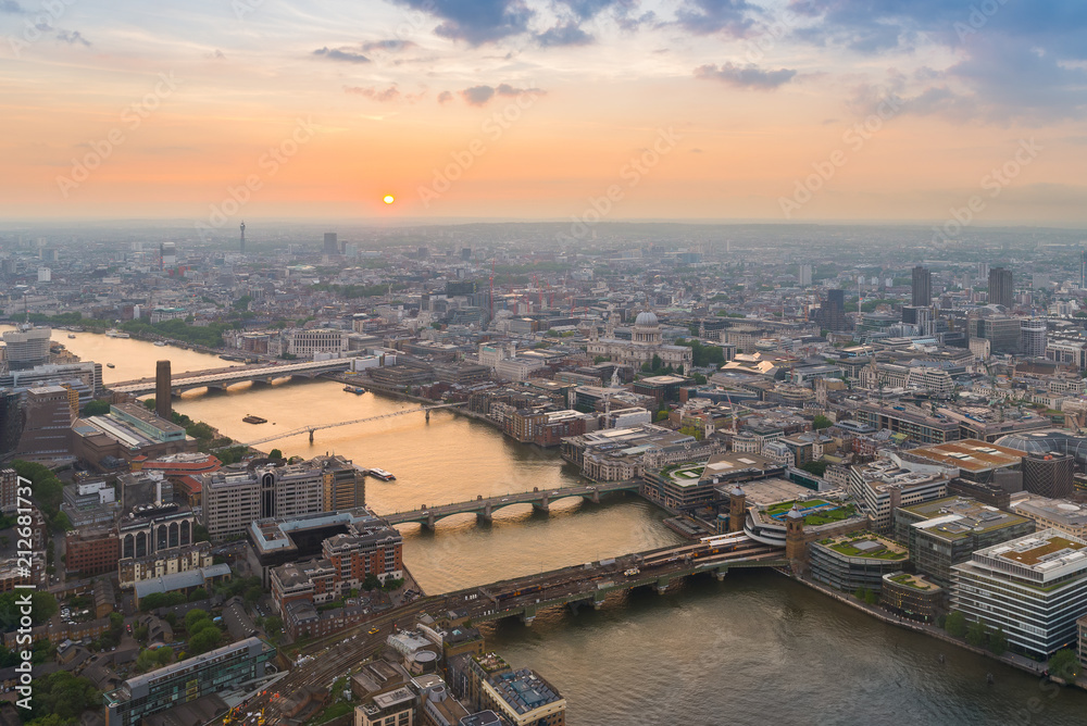 London city with Thames river and its bridges at sunset, in United Kingdom
