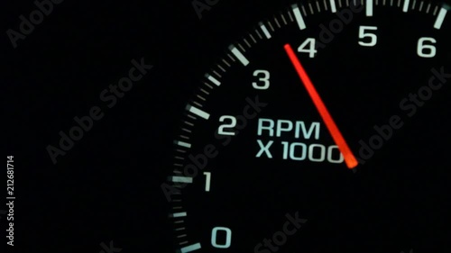 A Car or trucks dashboard RPM Gauge revs up from an idle at 500 up to 6000 and back down again.