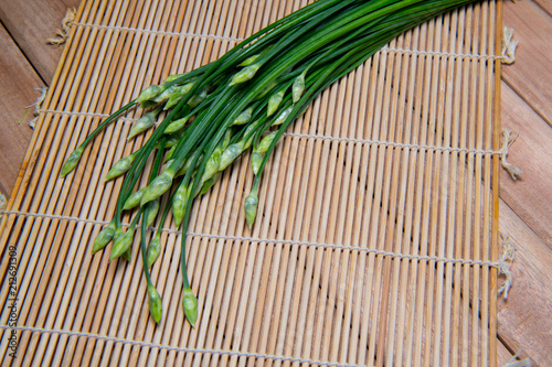 A bunch of fresh Garlic chives flowers  green Nira grass   isolated on white background.