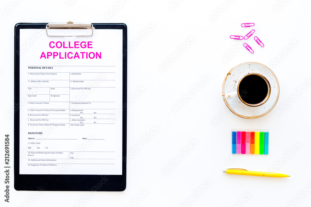 Apply college. Empty college application form near coffee cup and stationery on white background top view space for text Apply college. Empty college application form near coffee cup and stationery on white background top view space for text