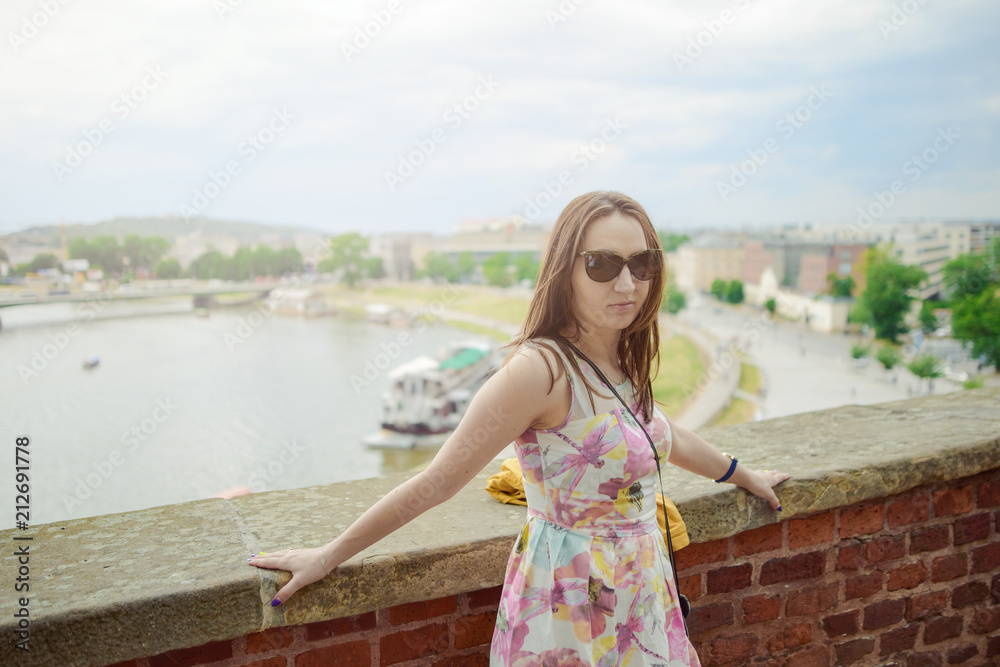 A stylish girl looking at the river