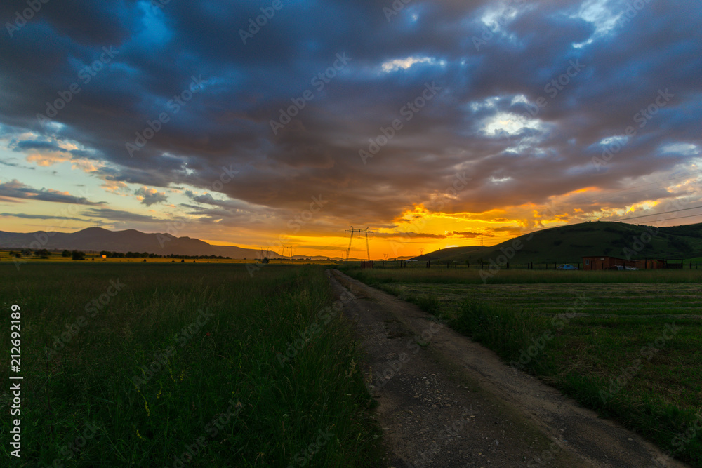Storm clouds at the sunset in the summer Storm clouds at the sunset in the summer