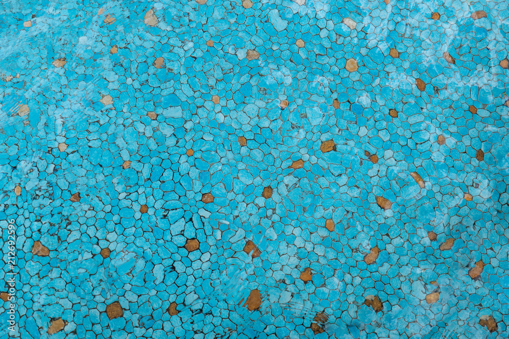Turquoise and gold pool tiles with water Turquoise and gold pool tiles with water