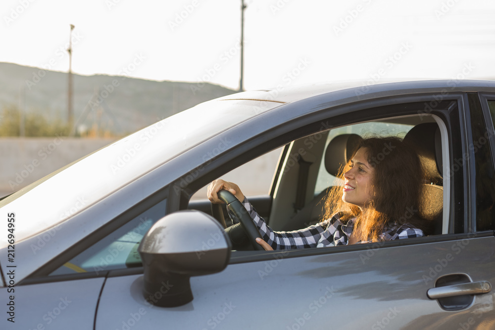Naklejka premium woman driving a new car. Car, people concept.