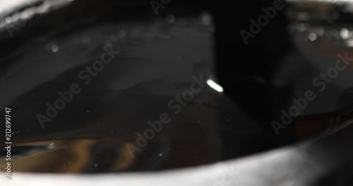 Korean traditional painting artist rubbing ink stick on ink stone