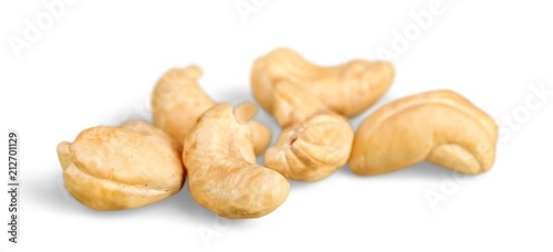 Several cashew nuts on white