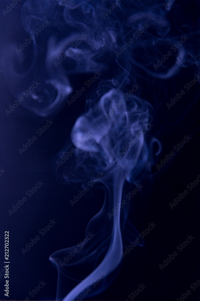 The purple clubs smoke on a black background. Fluid effect.