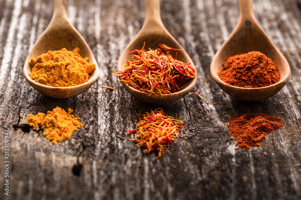 Various spices on wooden spoons. Food ingredients Various spices on wooden spoons. Food ingredients