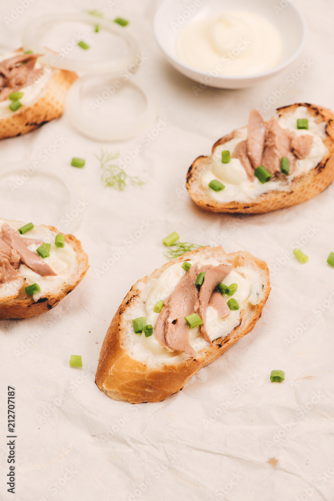 Italian cuisine. Bruschetta with tuna, onion, and mayonnaise. Italian cuisine. Bruschetta with tuna, onion, and mayonnaise.