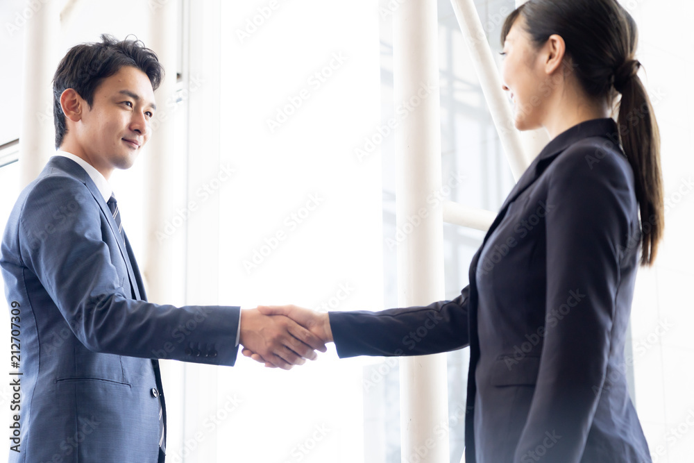 asian businessgroup shaking hands