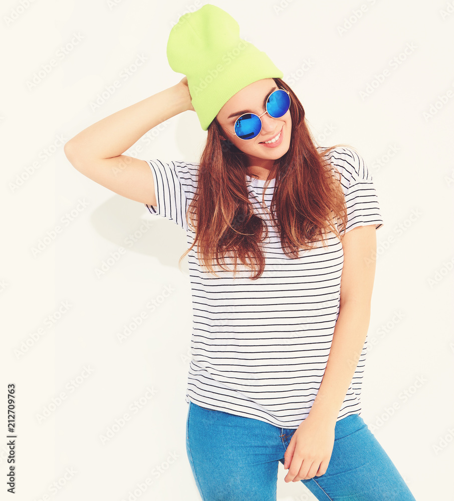 Portrait of young stylish girl model in casual summer clothes in yellow beanie hat. Isolated on white Portrait of young stylish girl model in casual summer clothes in yellow beanie hat. Isolated on white