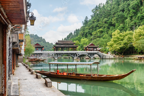 Parked wooden tourist boat on the Tuojiang River, Fenghuang