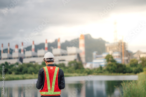 Asian male power plant engineer is working