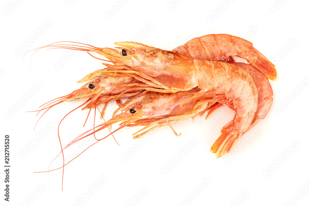 Overhead photo of three raw shrimps on white, with copy space Overhead photo of three raw shrimps on white, with copy space