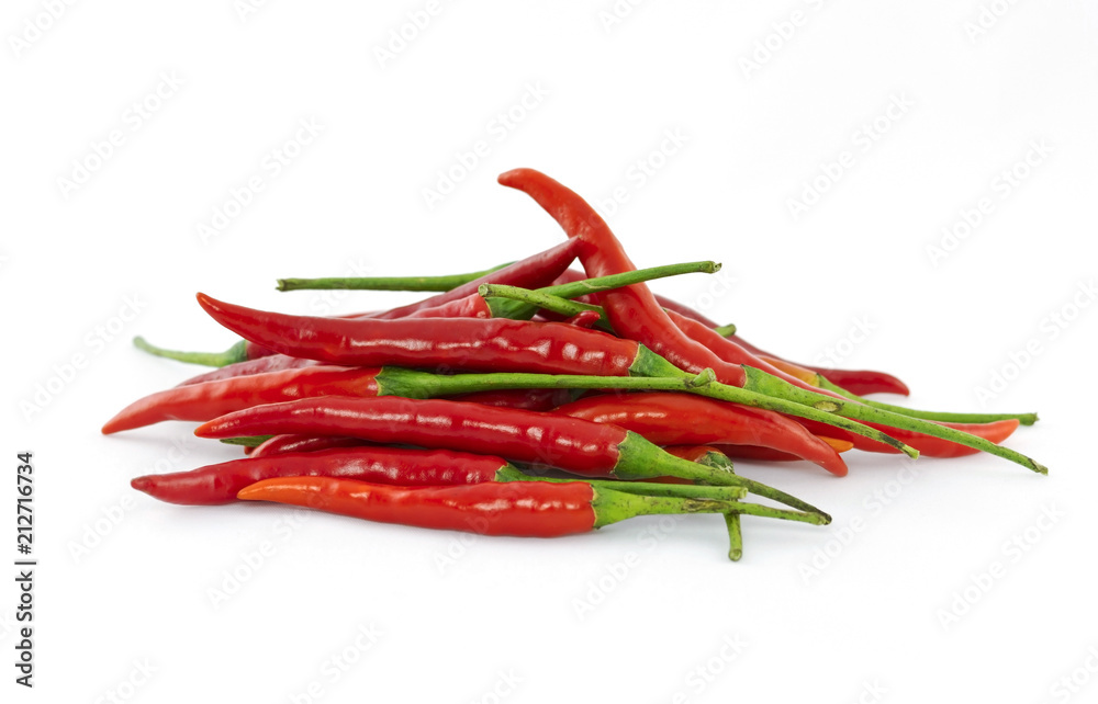 Heap of red hot chili peppers isolated on white background