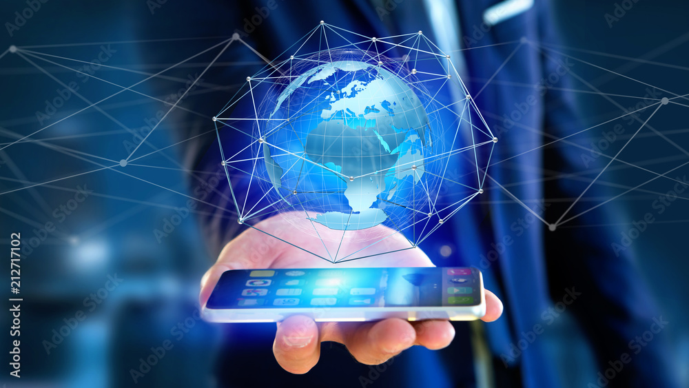 Fotografie Businessman using smartphone with a Connected network over a earth globe concept