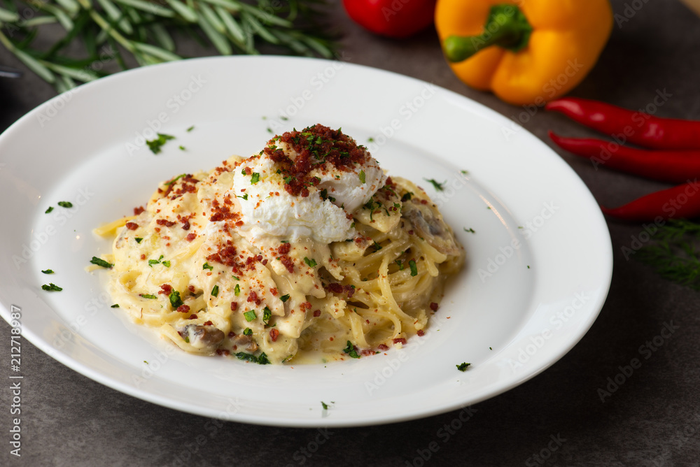 Pasta carbonara and poach egg and chicken