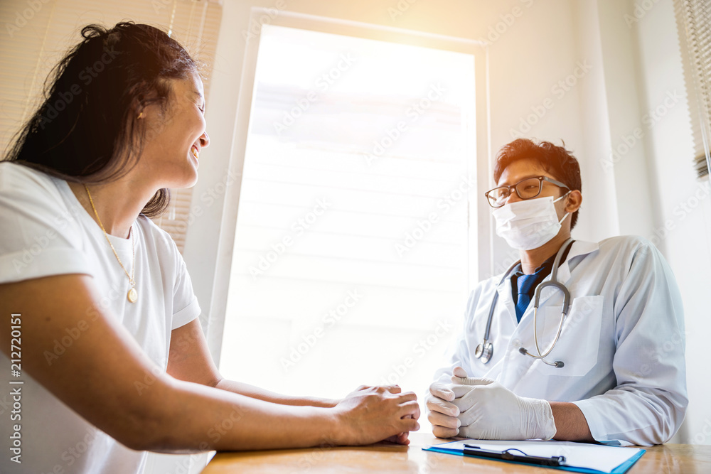A doctor is working in the hospital, he is wearing a brown stethoscope and he is investigating the illness of the patient. A doctor is working in the hospital, he is wearing a brown stethoscope and he is investigating the illness of the patient.