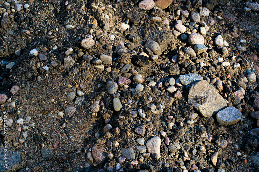A bunch of sand and stones is close A bunch of sand and stones is close
