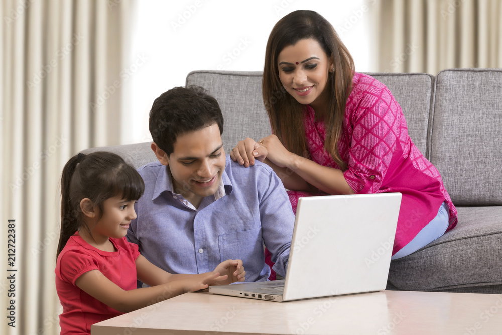 Smiling family shopping online Smiling family shopping online