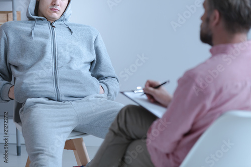 Fototapeta Naklejka Na Ścianę i Meble -  Juvenile offender talking to his curator during a meeting