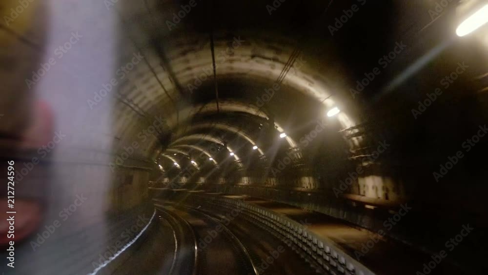 Moving train in subway tunnel view from cabin. 3840x2160