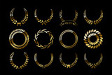 Set of golden laurel wreaths isolated on black background. Vector design elements.