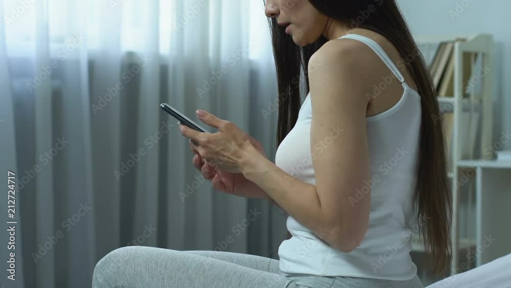 Woman using smartphone suffering wrist pain, carpal tunnel symptom, arthritis Woman using smartphone suffering wrist pain, carpal tunnel symptom, arthritis