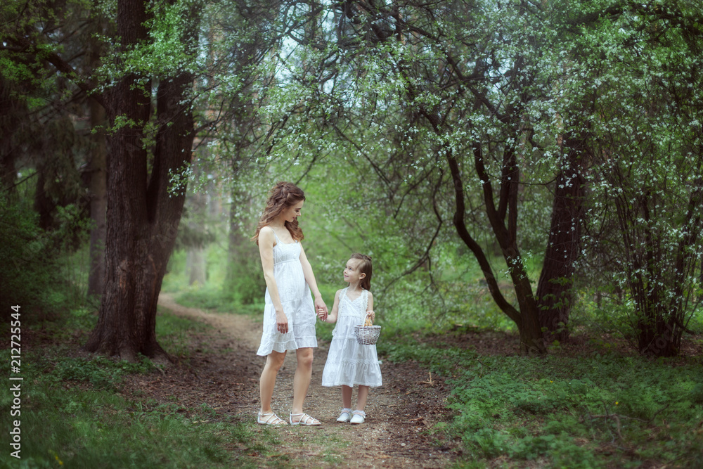 Mom and daughter in a fairy forest. Mom and daughter in a fairy forest.