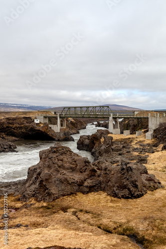 Water of stormy mountain river from waterfall - beautiful part of stony rocky desert landscape of Iceland