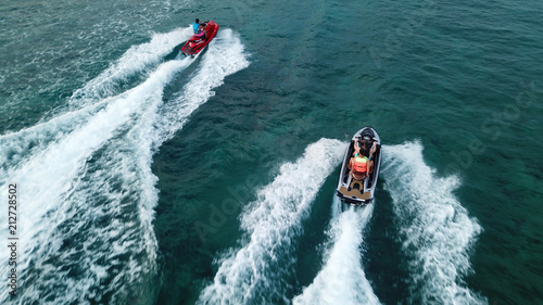 Aerial drone photo of Jet ski cruising in tropical waters