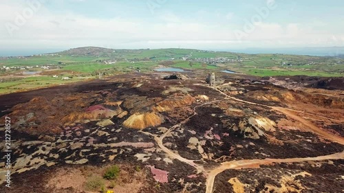 The colourful remains of the former copper mine Parys Mountain near Amlwch on the Isle of Anglesey, Wales, UK photo