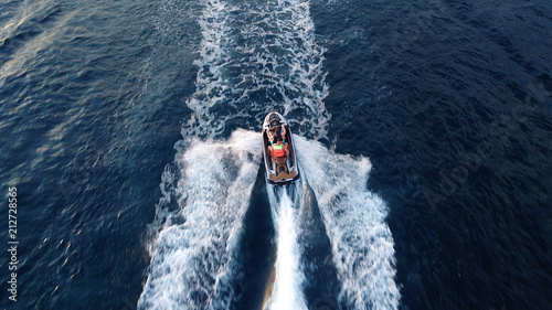 Aerial drone photo of Jet ski cruising in tropical waters © aerial-drone