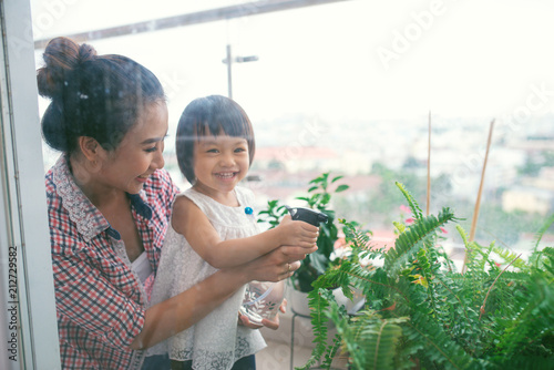 Mother and toddler daughter's spring gardening