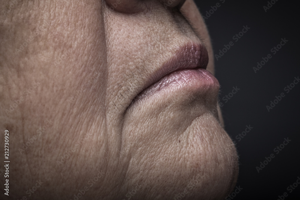 Studio portrait of elderly woman. Profile. Close up detail. Toned Studio portrait of elderly woman. Profile. Close up detail. Toned