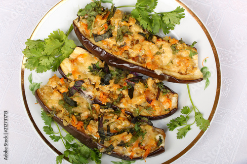 Stuffed eggplant with meat and vegetables with cheese, baked in the oven. Top view