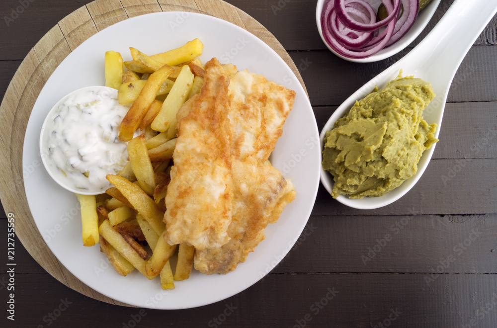 The fish and chips. A traditional English dish. The fish and chips. A traditional English dish.