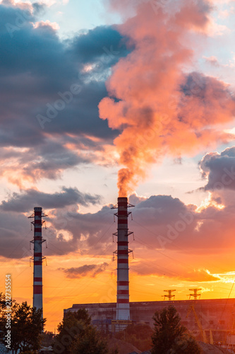 Thermal power plant at dusk. Smoking stack of the thermal power station