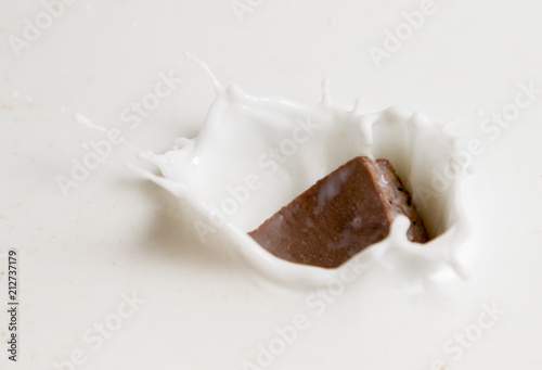 Chocolate falls in milk